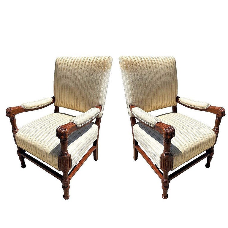 Pair of Mediterranean Style Carved Walnut Lion Paw Armchairs