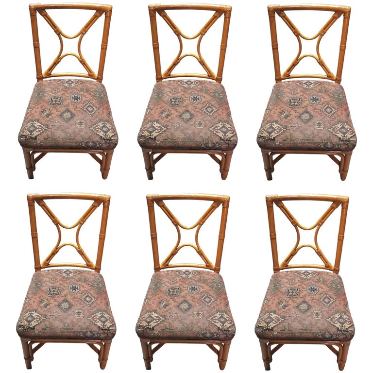 Restored Rattan set of 6 Dining Chairs Featuring X-back and Leather Wrappings.