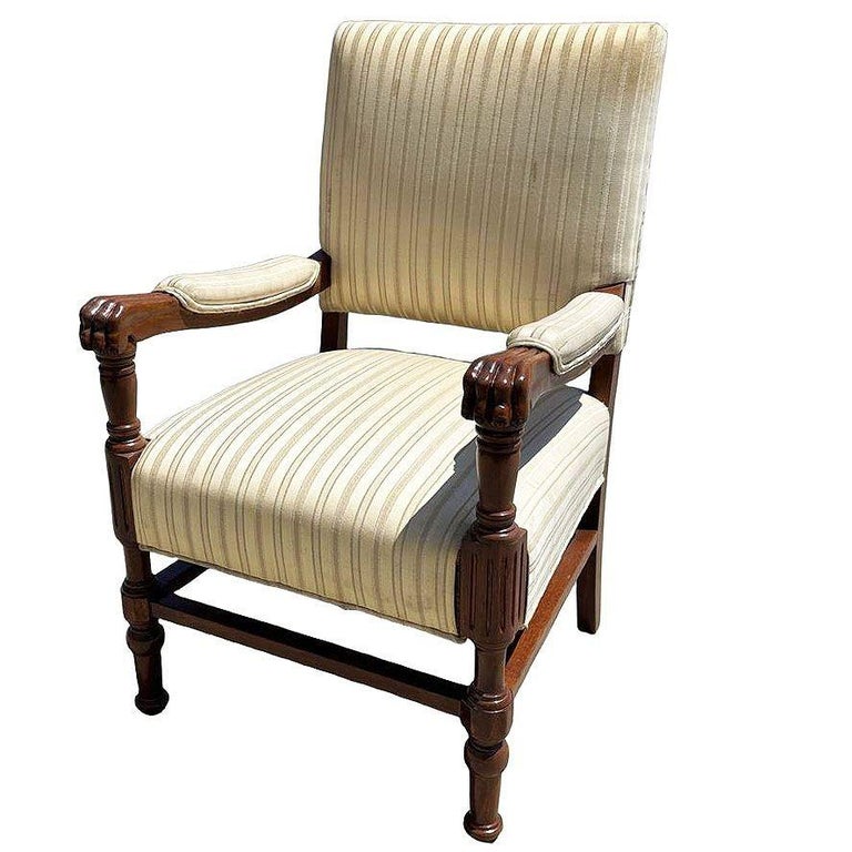 Pair of Mediterranean Style Carved Walnut Lion Paw Armchairs