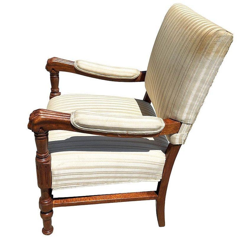 Pair of Mediterranean Style Carved Walnut Lion Paw Armchairs