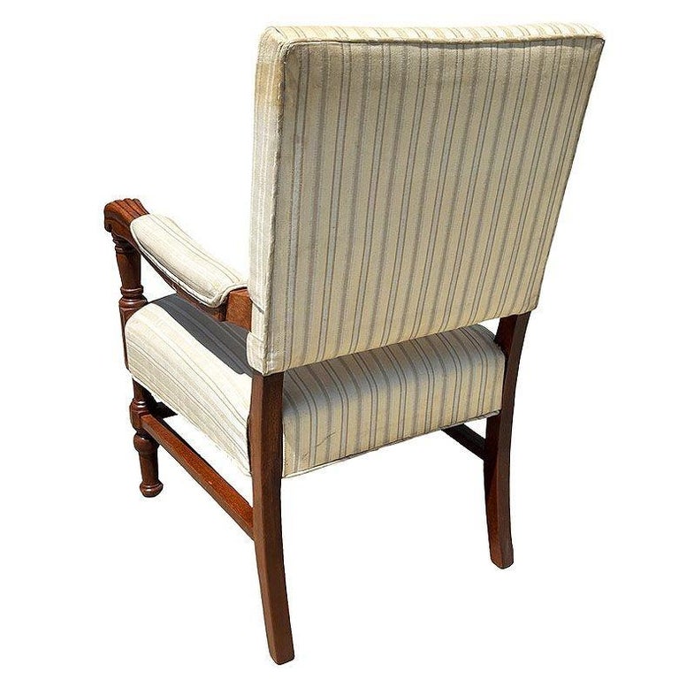 Pair of Mediterranean Style Carved Walnut Lion Paw Armchairs
